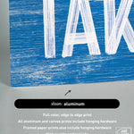 a picture of a blue and white sign that says take