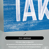 a picture of a blue and white sign that says take