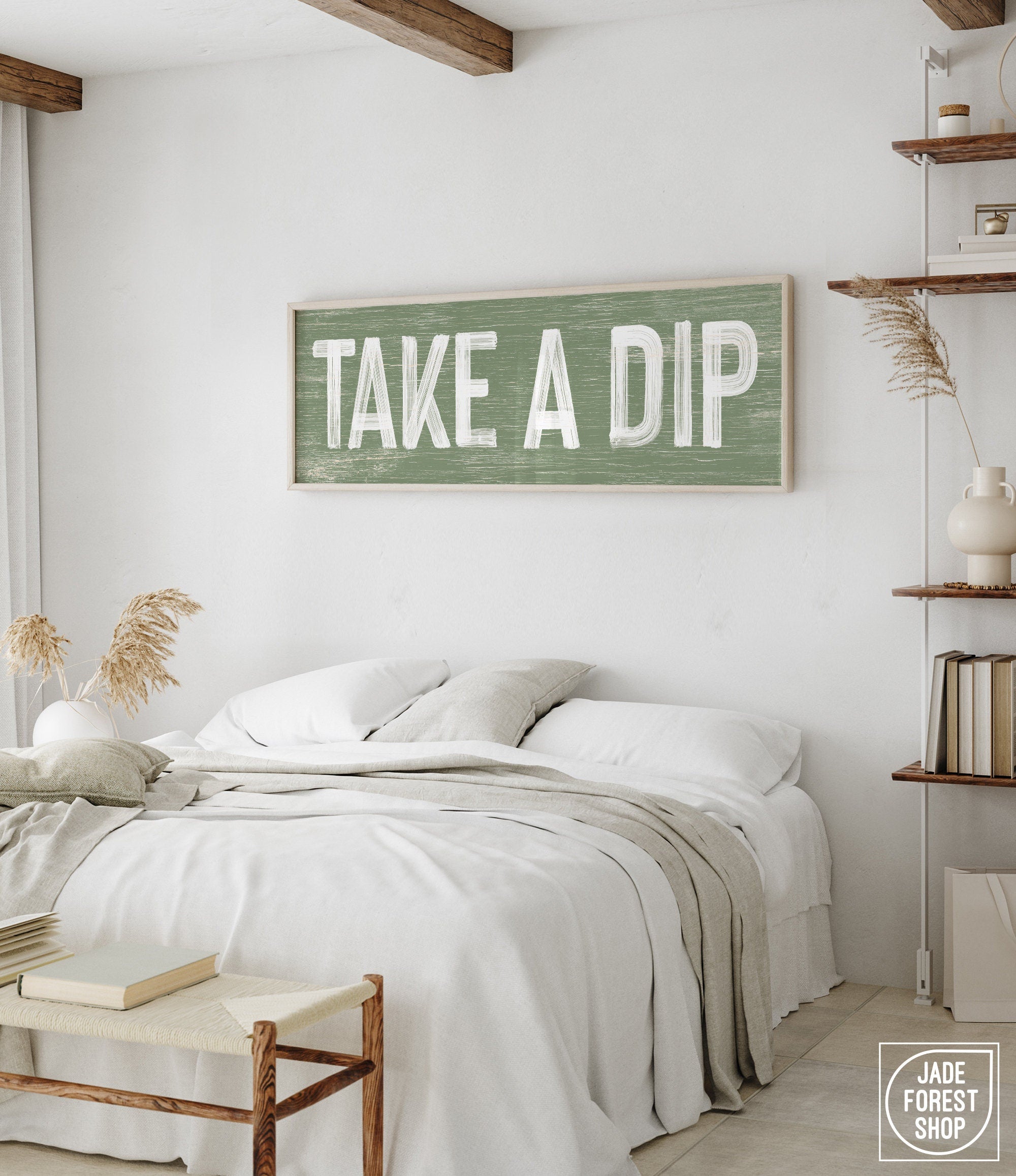 a bedroom with a bed and a sign on the wall