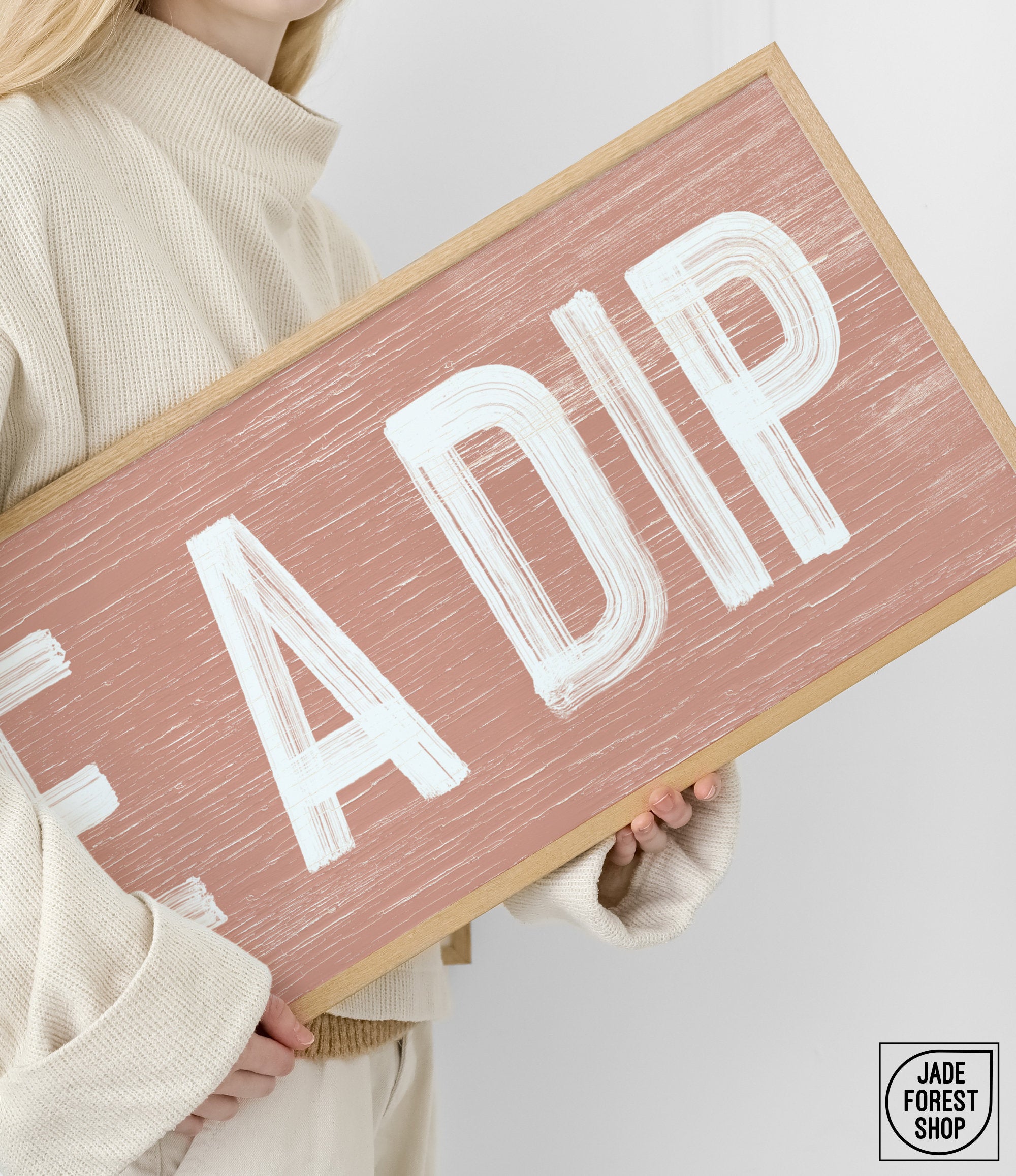 a woman holding a sign that says fadip