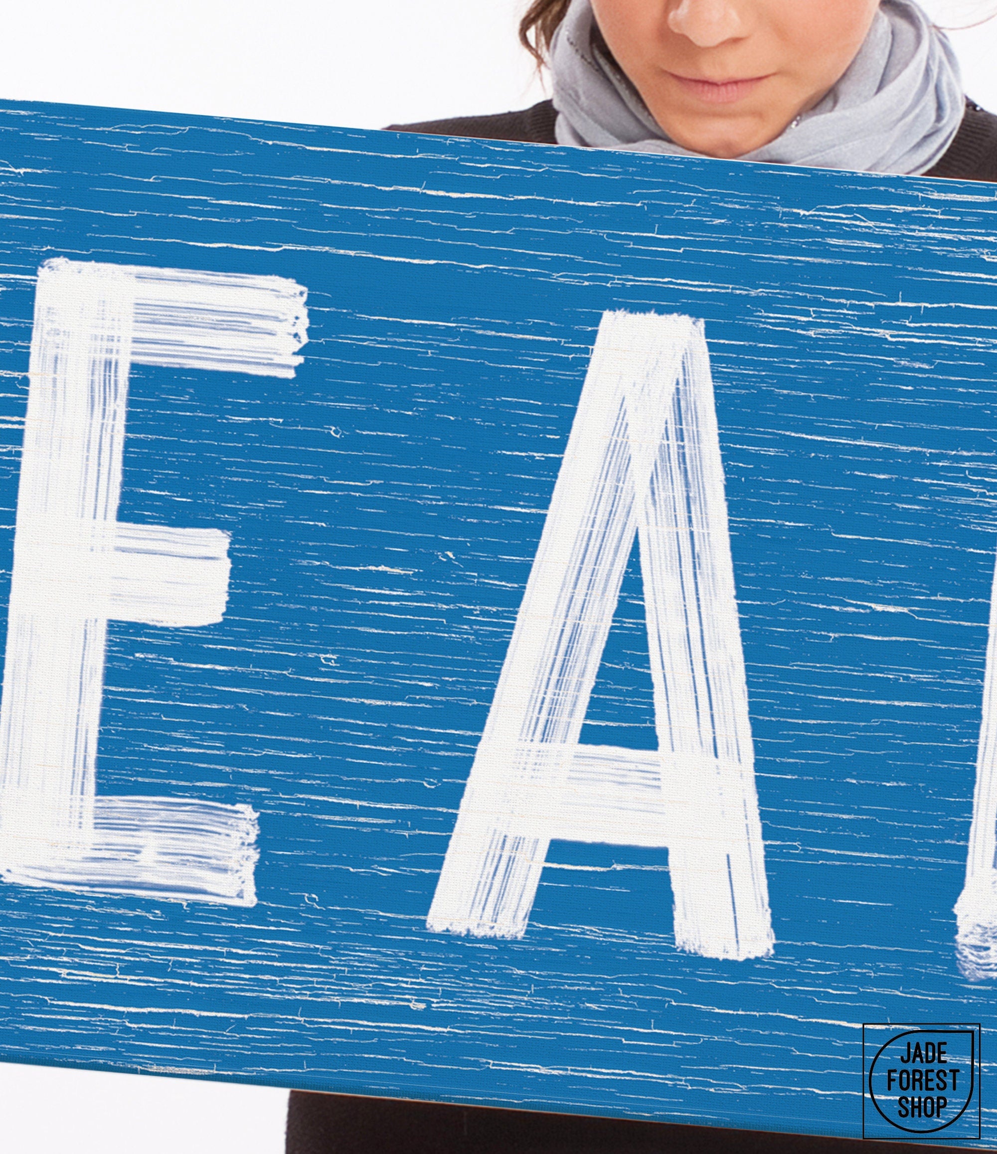 a woman holding a sign that says eat