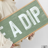 a woman holding a sign that says fadip