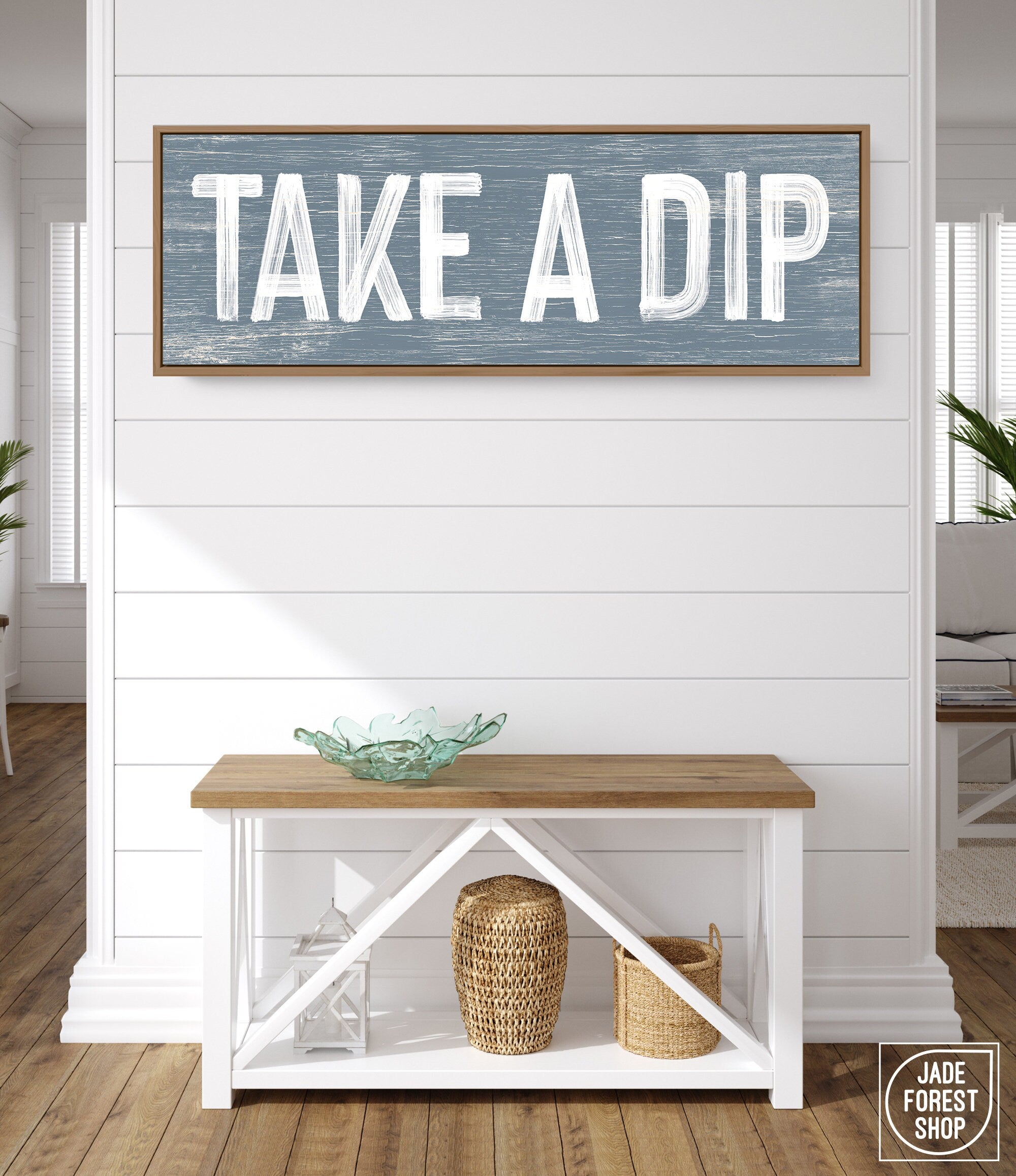 a wooden sign that says take a dip on a wall