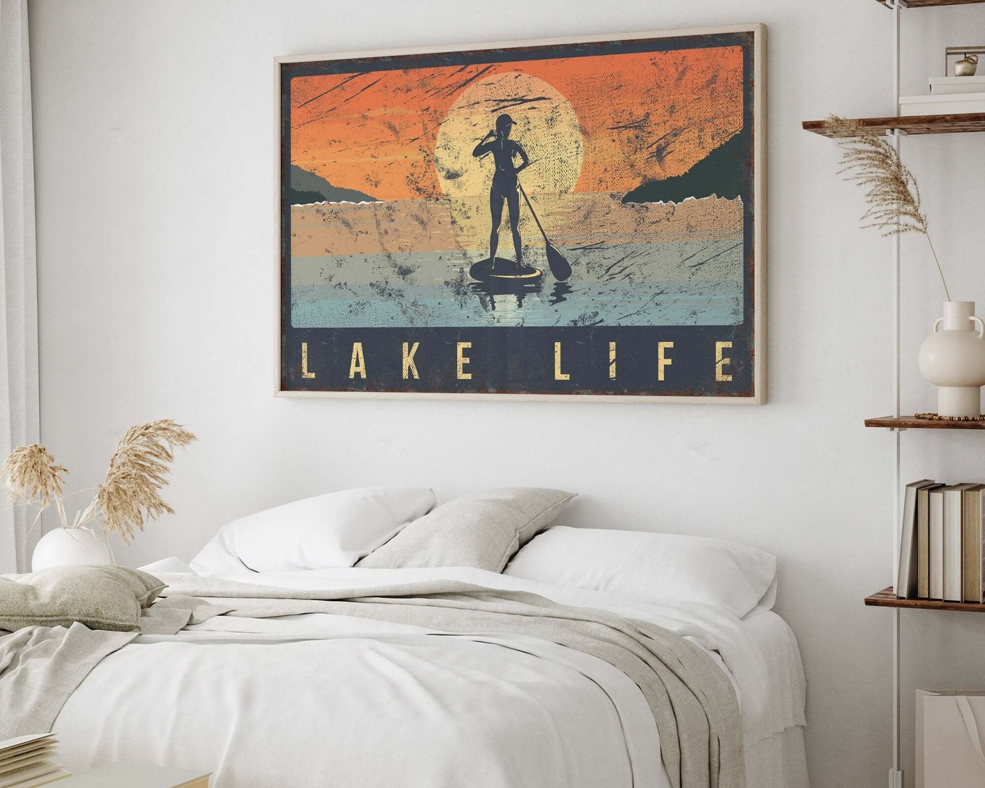 a bedroom with a bed and a painting on the wall