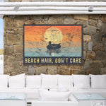 a stone wall with a sign that says beach hair don't care