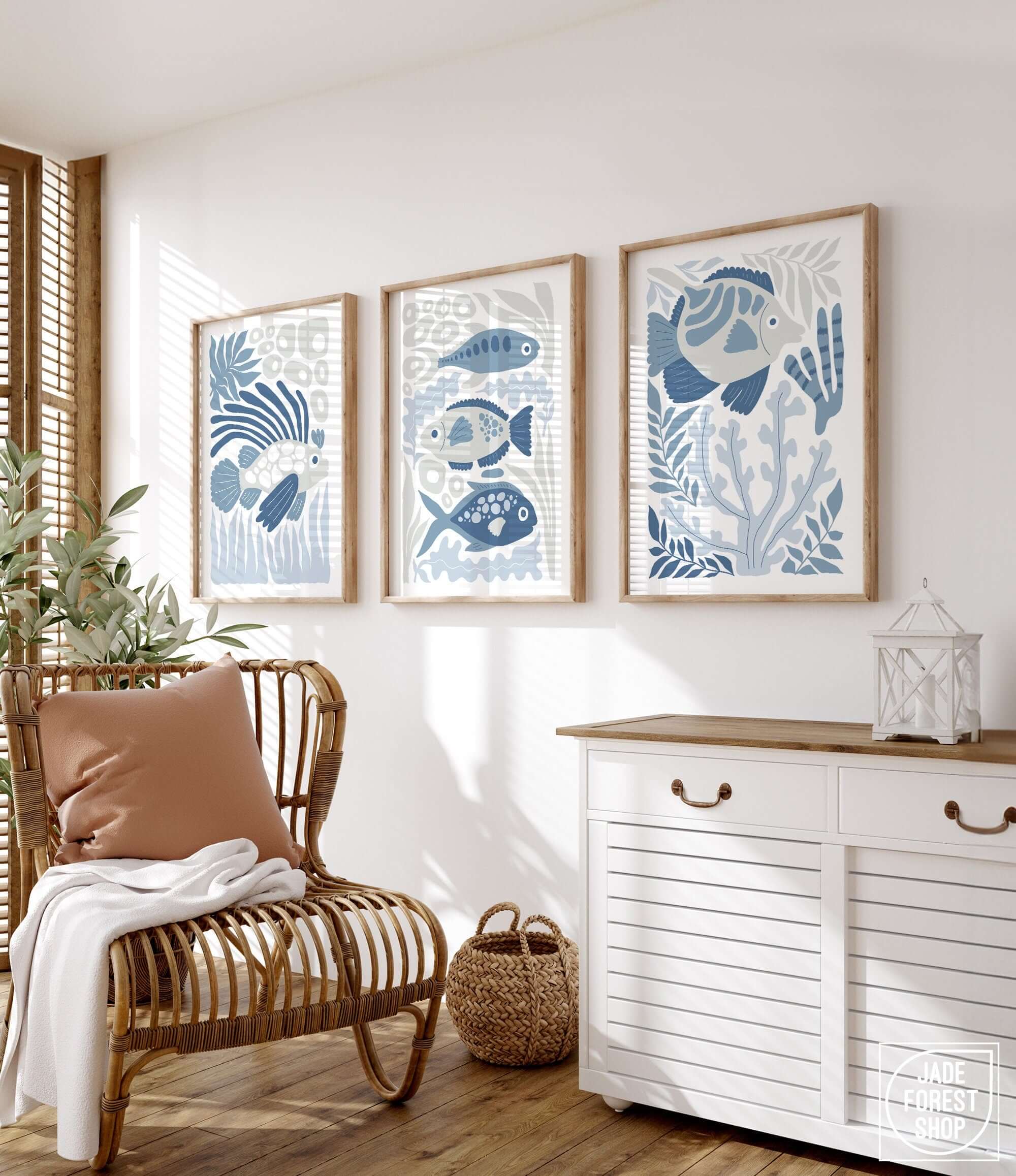 a living room with a chair and two paintings on the wall