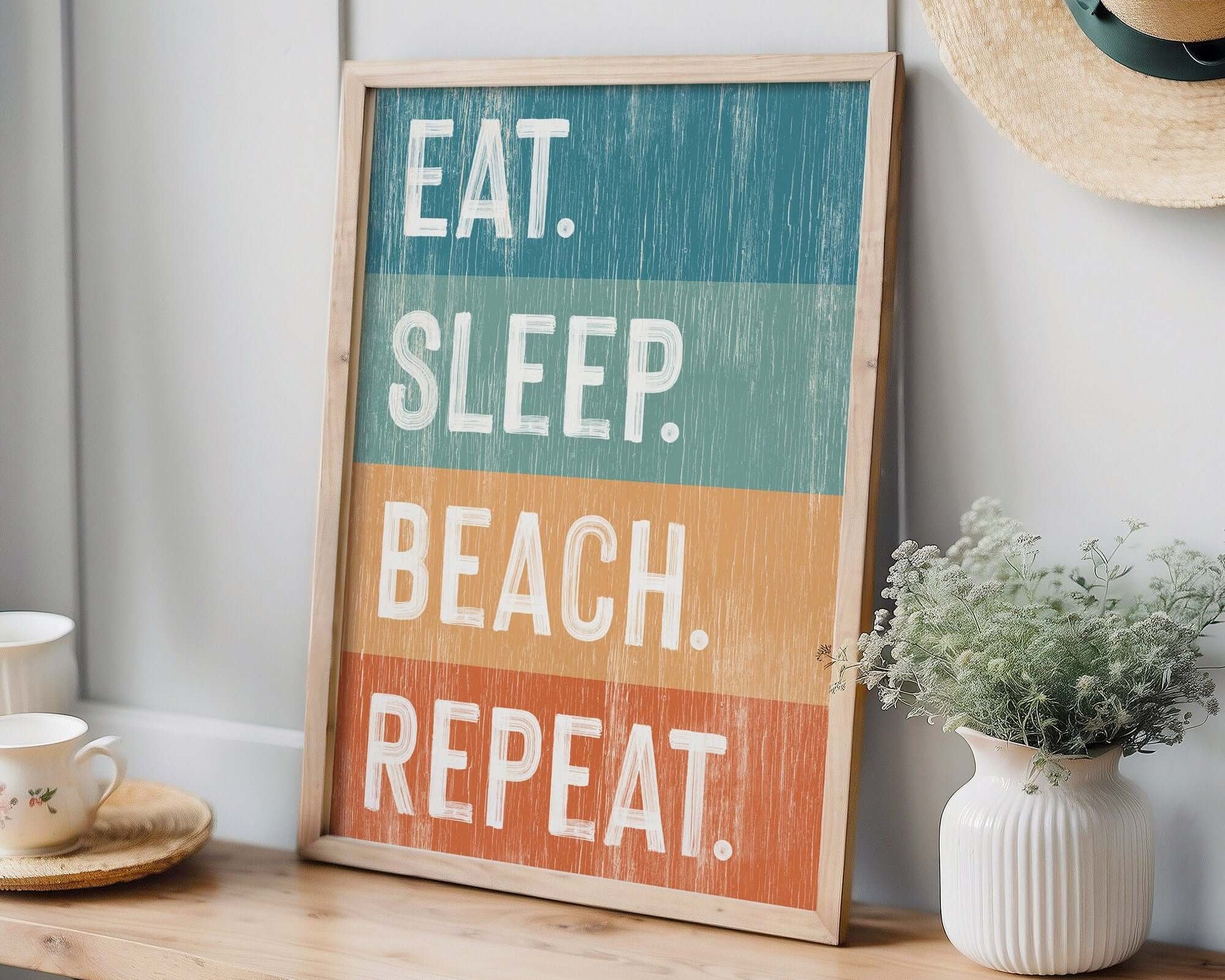 a sign that says eat sleep beach repeat