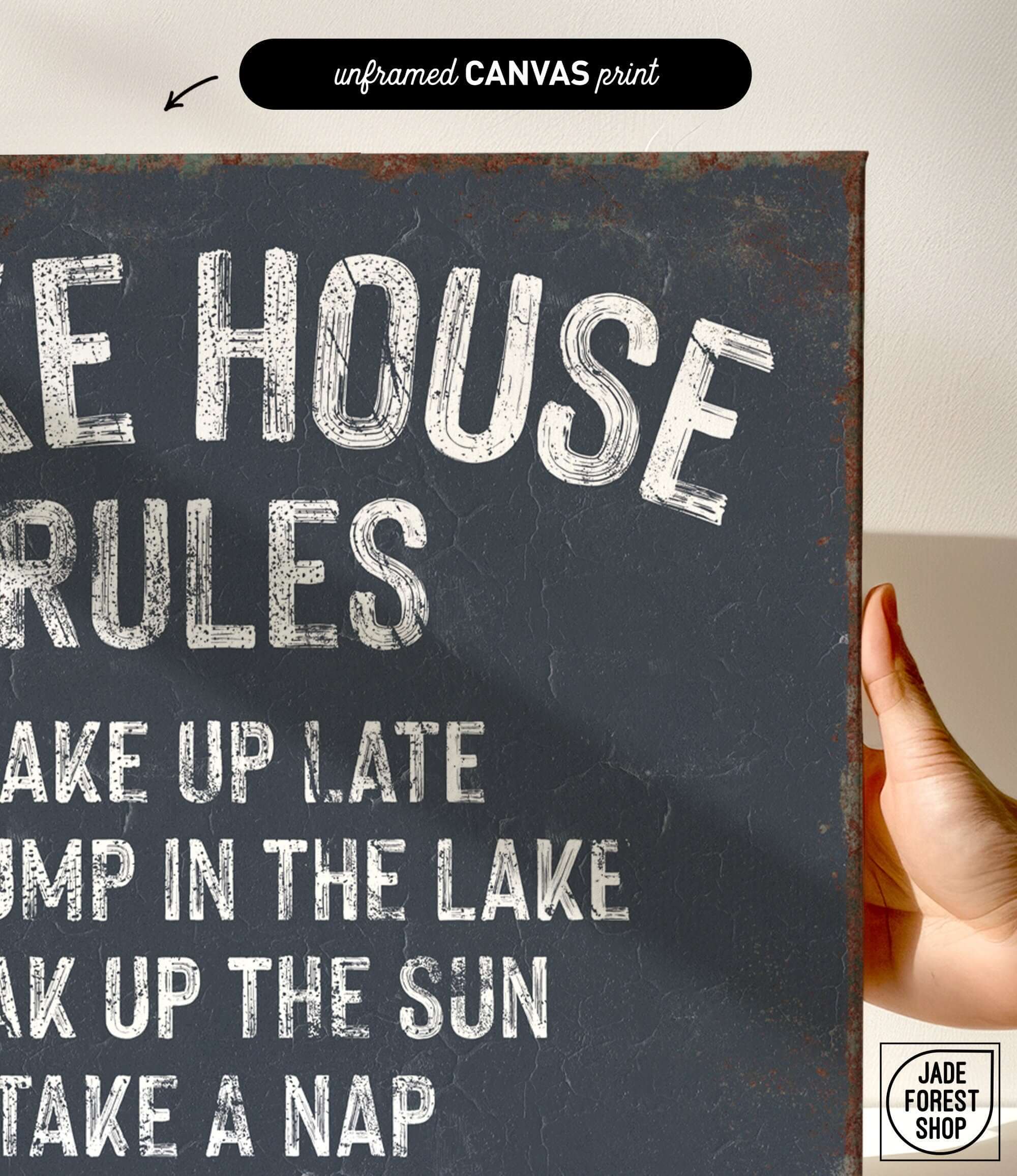 a hand holding a sign that says lake house rules