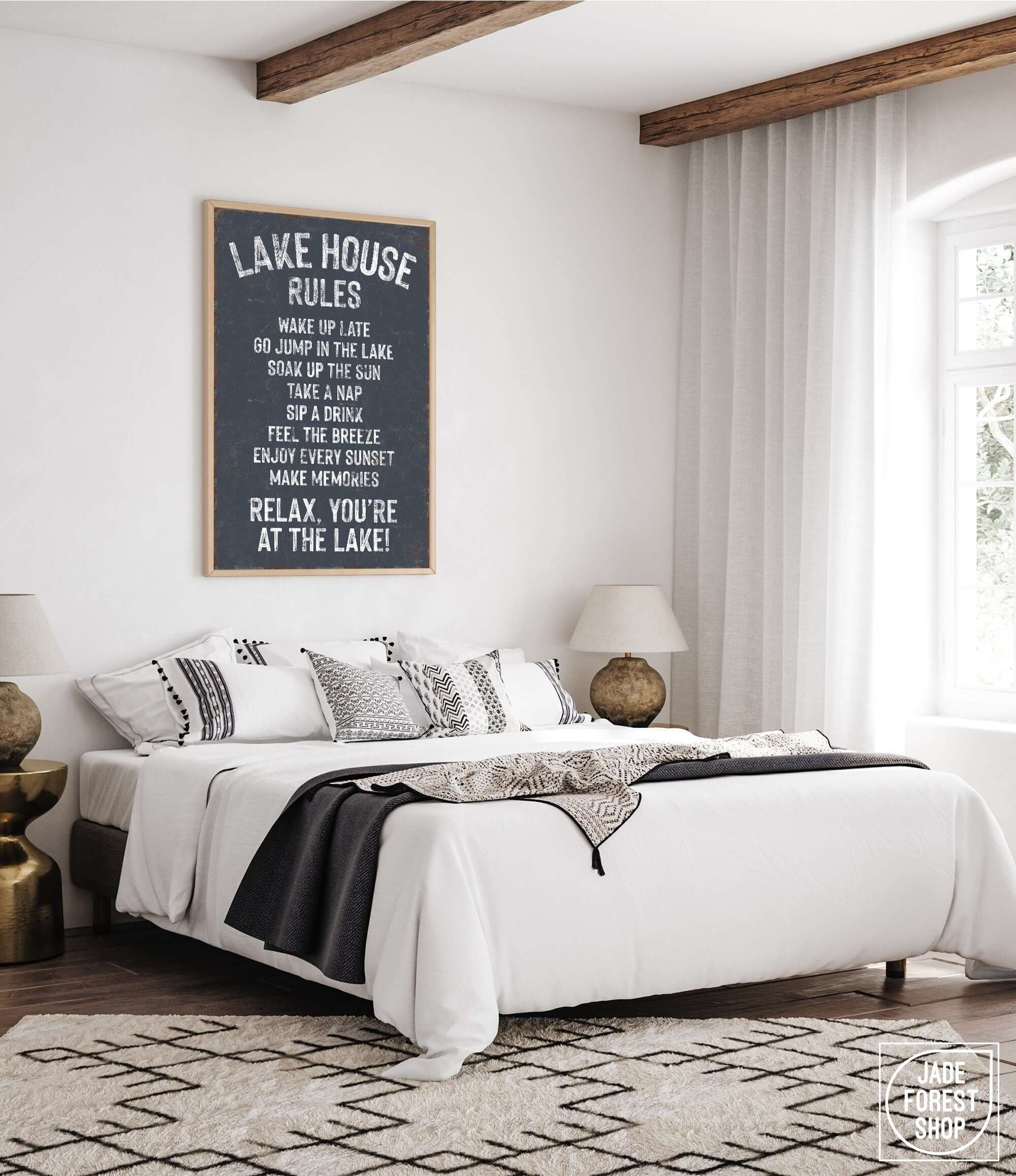 a bedroom with a large bed and a poster on the wall