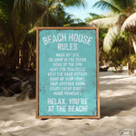 a sign on the beach that says beach house rules