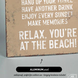 a sign that says relax you're at the beach