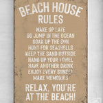 a sign on a wall that says beach house rules