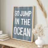 a picture of a sign that says go jump in the ocean