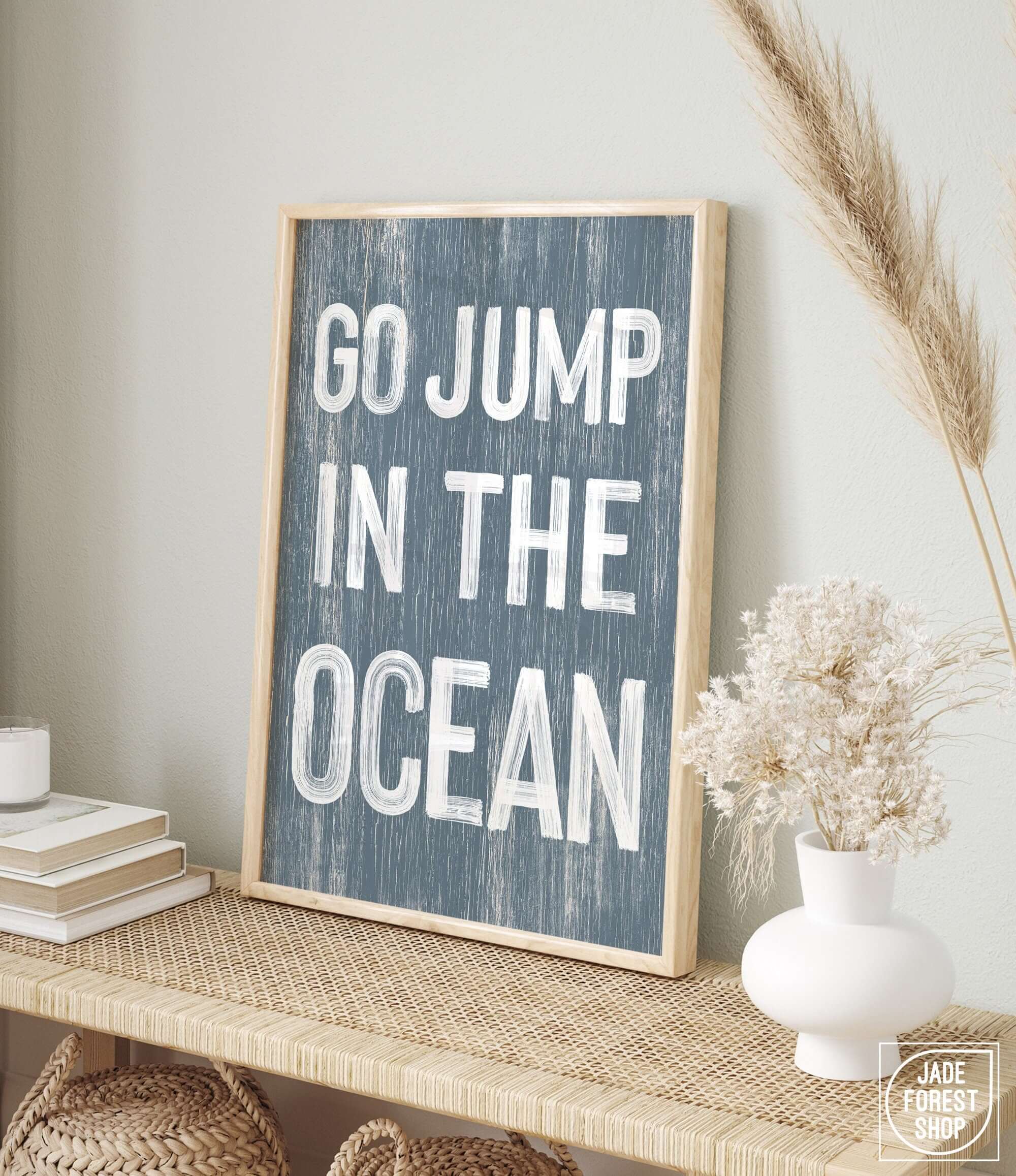 a picture of a sign that says go jump in the ocean