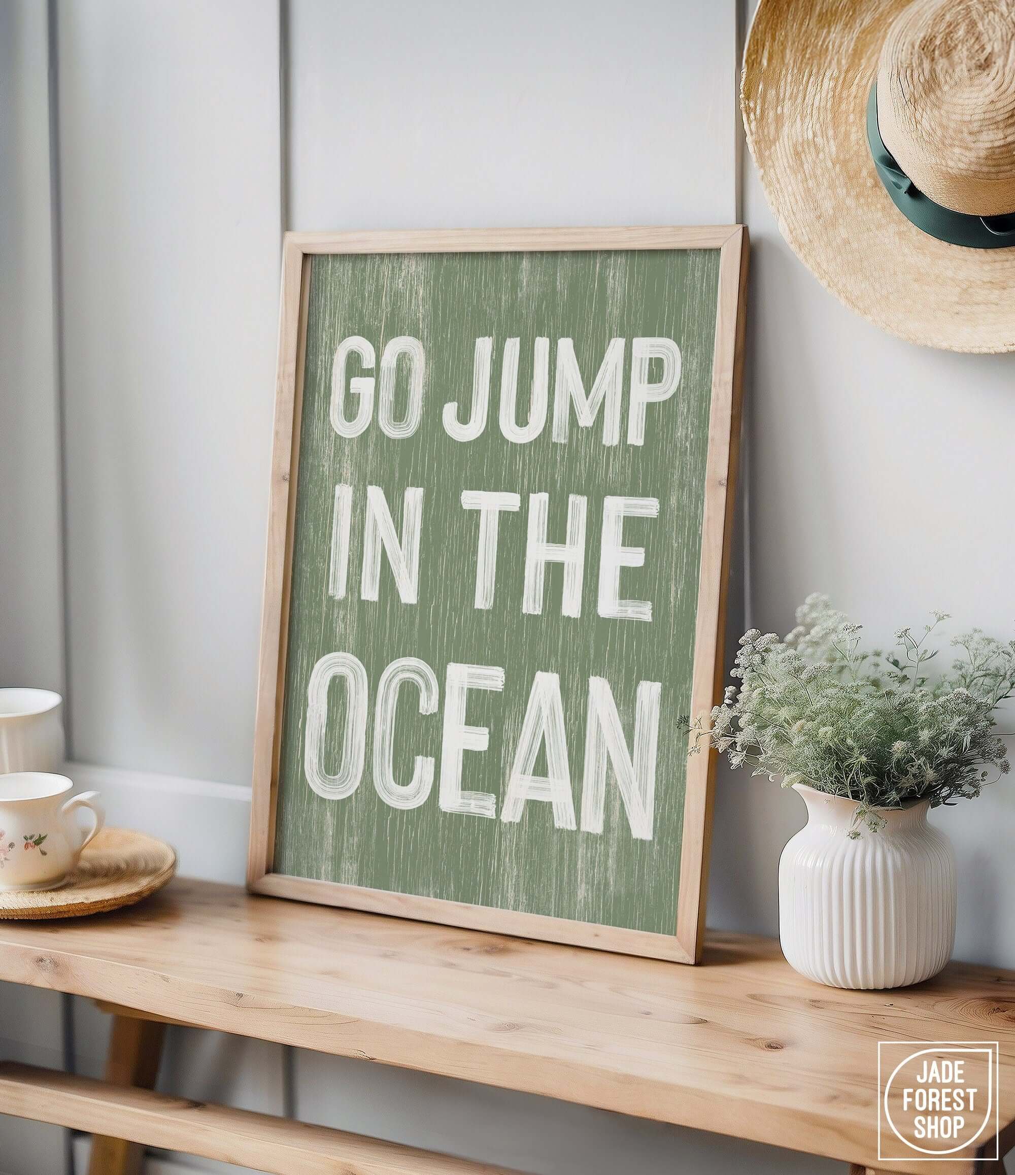 a sign that says go jump in the ocean