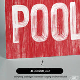 a close up of a red sign with the words pool on it