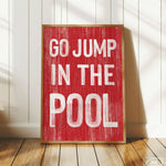 a red sign that says go jump in the pool