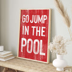 a picture of a sign that says go jump in the pool