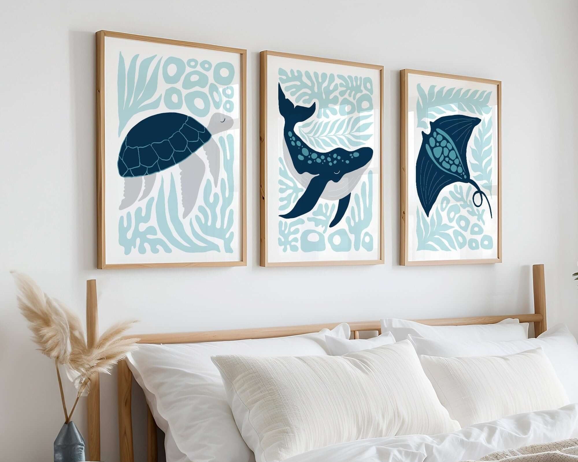 The Ocean Blocks Triptych | Set of Three Prints | 334 adds serene style as wall art above a bed with white bedding and light wood accents, elevating your home decor with ocean-inspired charm.