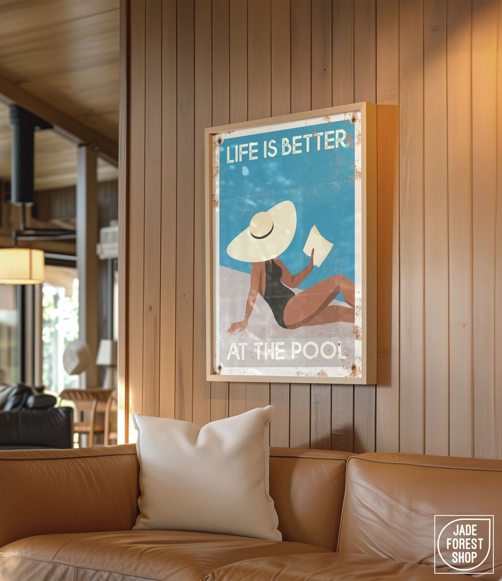 a poster hangs on the wall above a couch