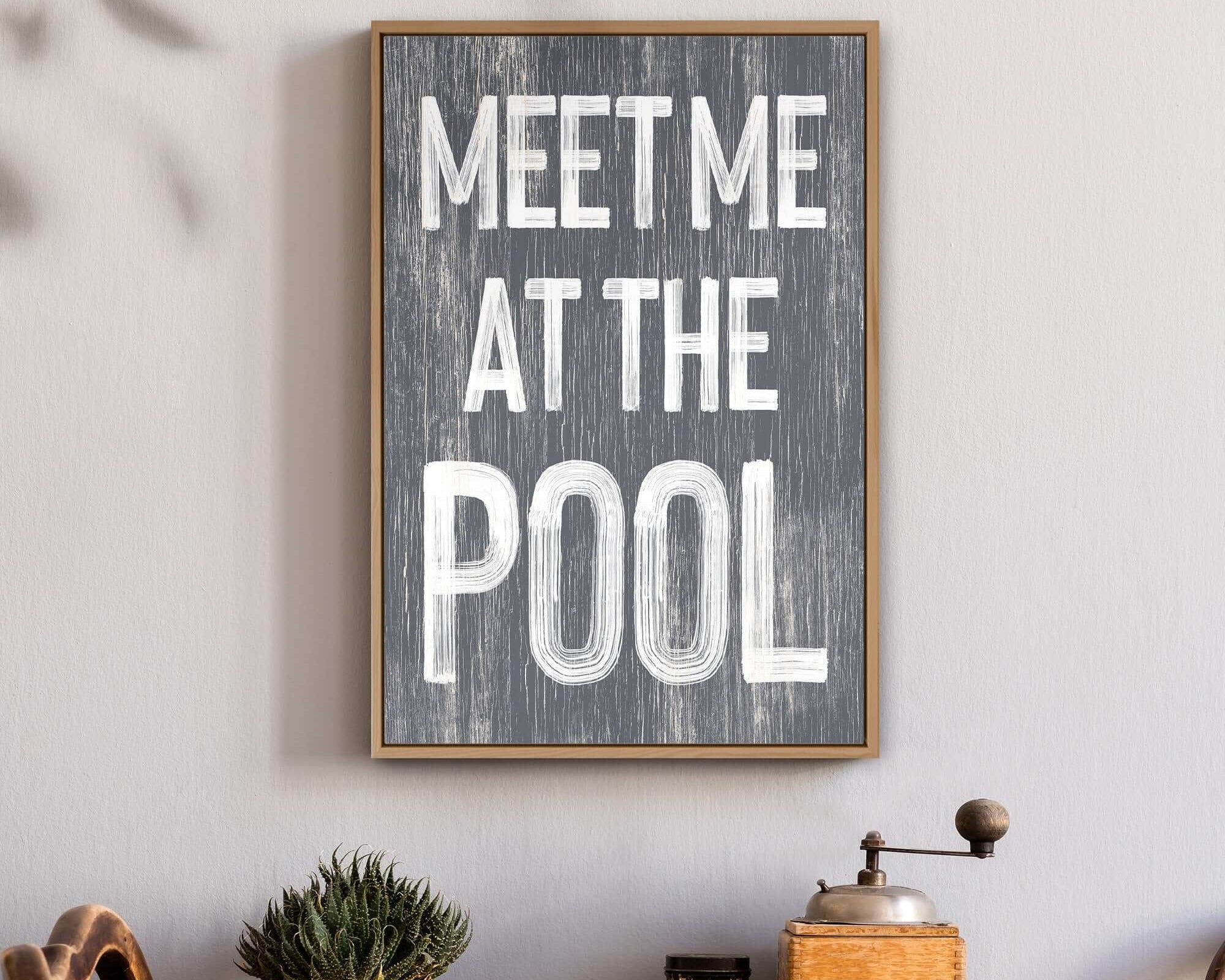 The Meet Me at the Pool Sign, Slate is a framed retro wall piece reading "MEET ME AT THE POOL"—ideal for adding modern farmhouse style to your decor.