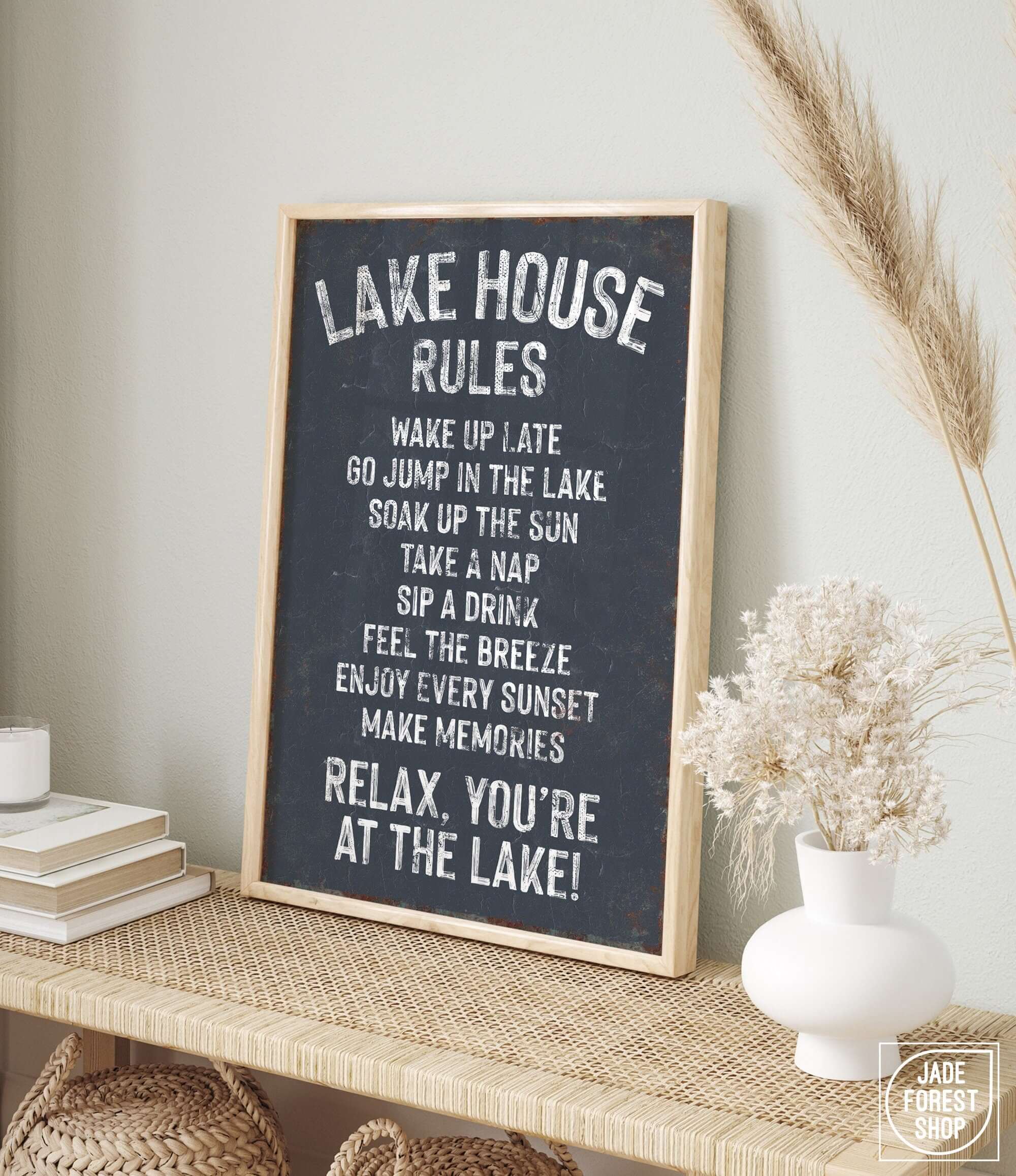 a sign that says lake house rules on a shelf