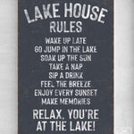 a sign on a wall that says lake house rules