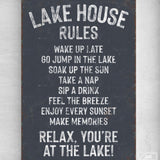 a sign on a wall that says lake house rules