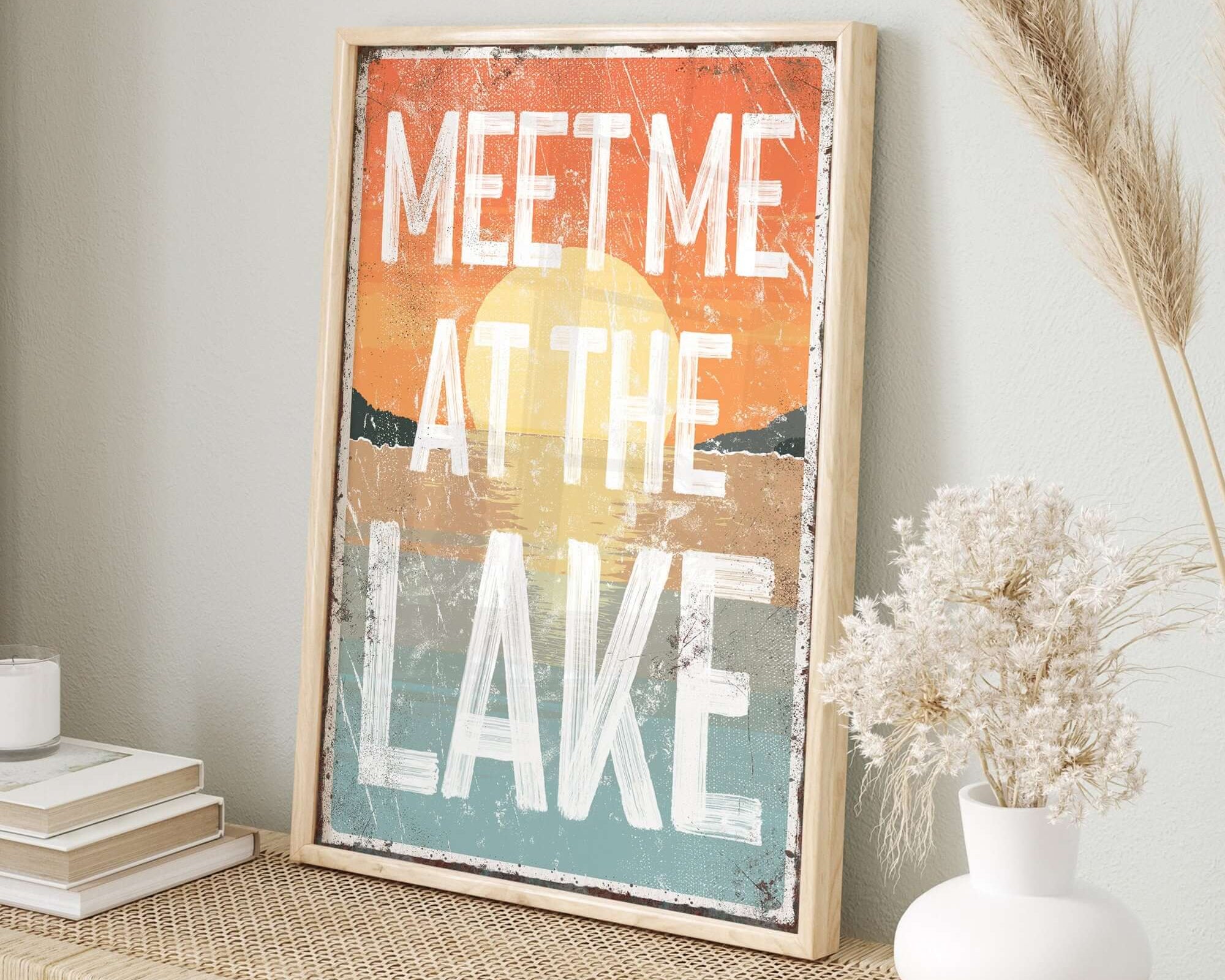 a picture of a sign that says meet me at the lake