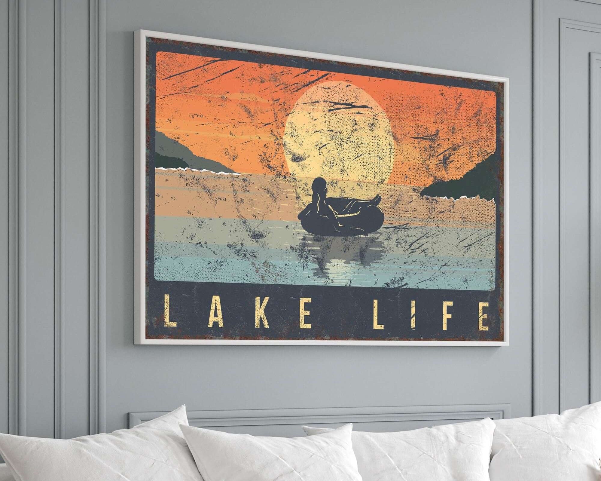 a living room with a couch and a painting on the wall
