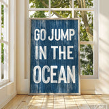 a blue sign that says go jump in the ocean