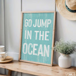 a sign that says go jump in the ocean