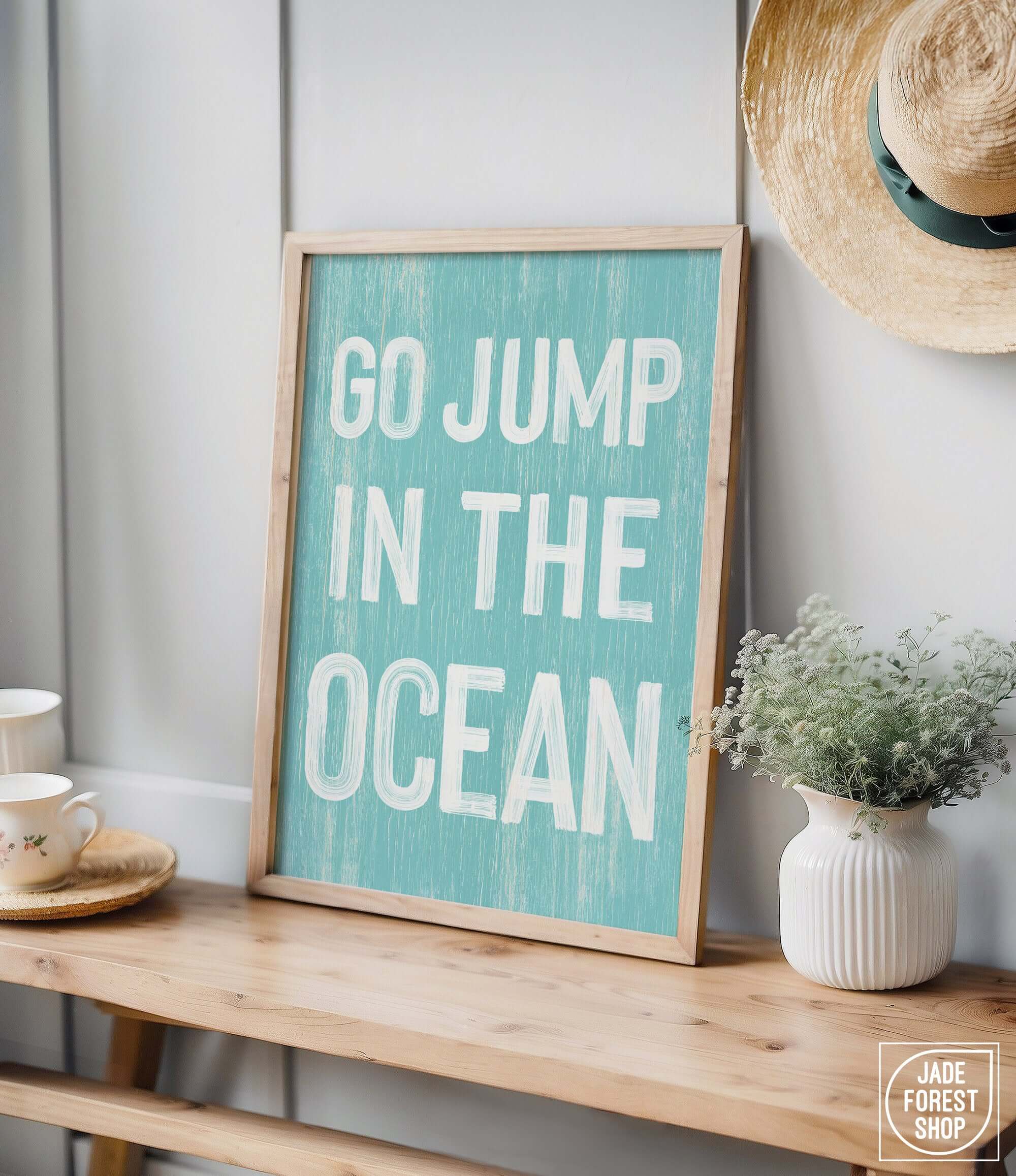 a sign that says go jump in the ocean