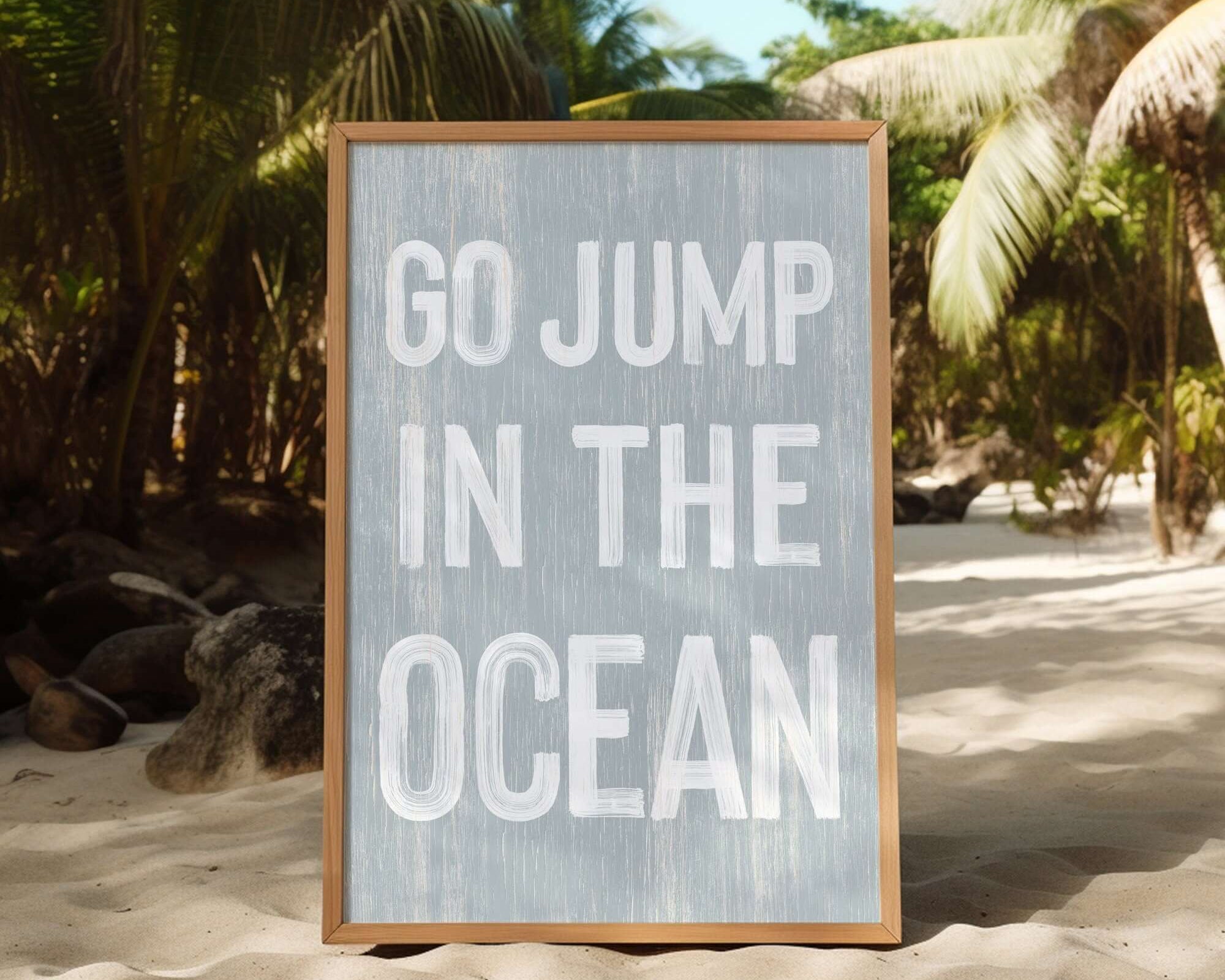 a sign that says go jump in the ocean