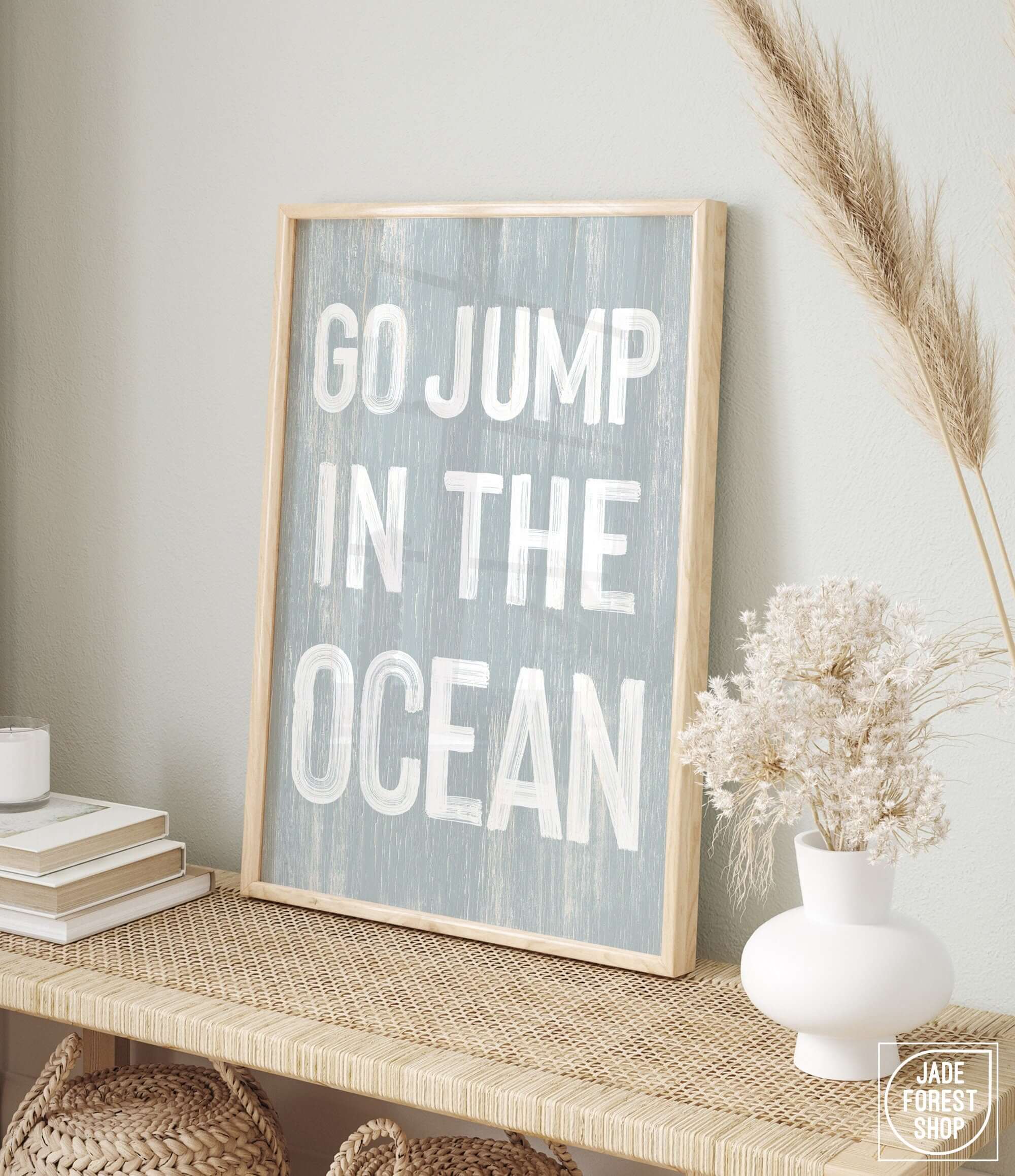 a picture of a sign that says go jump in the ocean