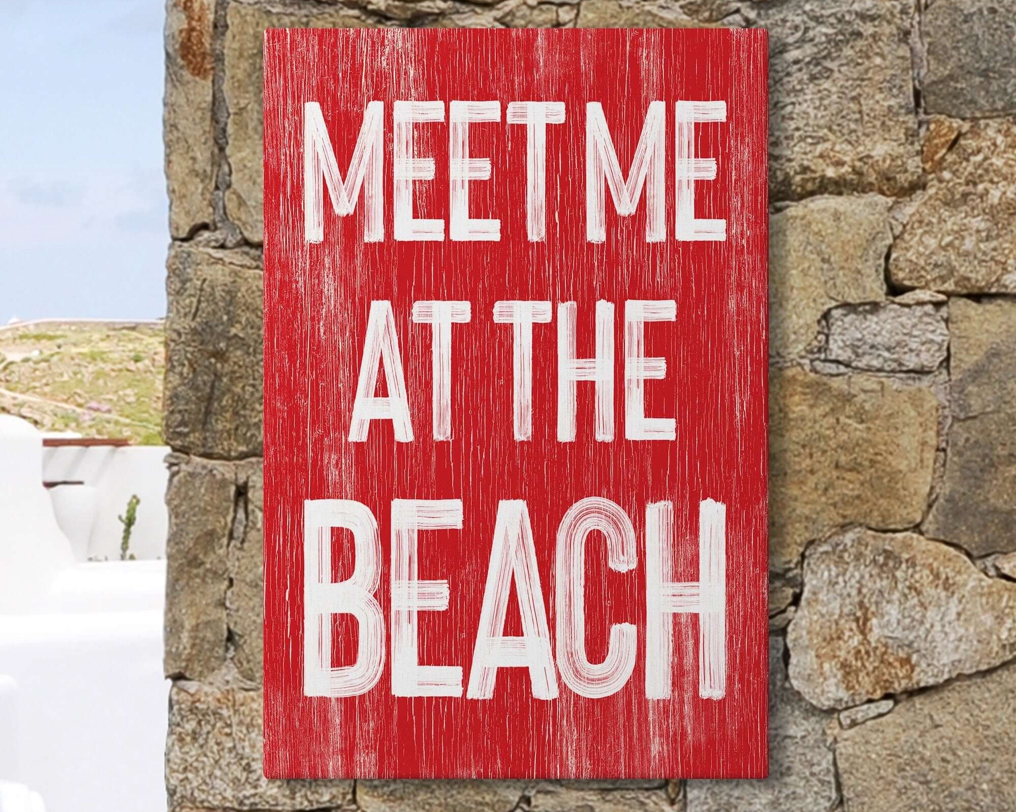 a red sign that says meet me at the beach