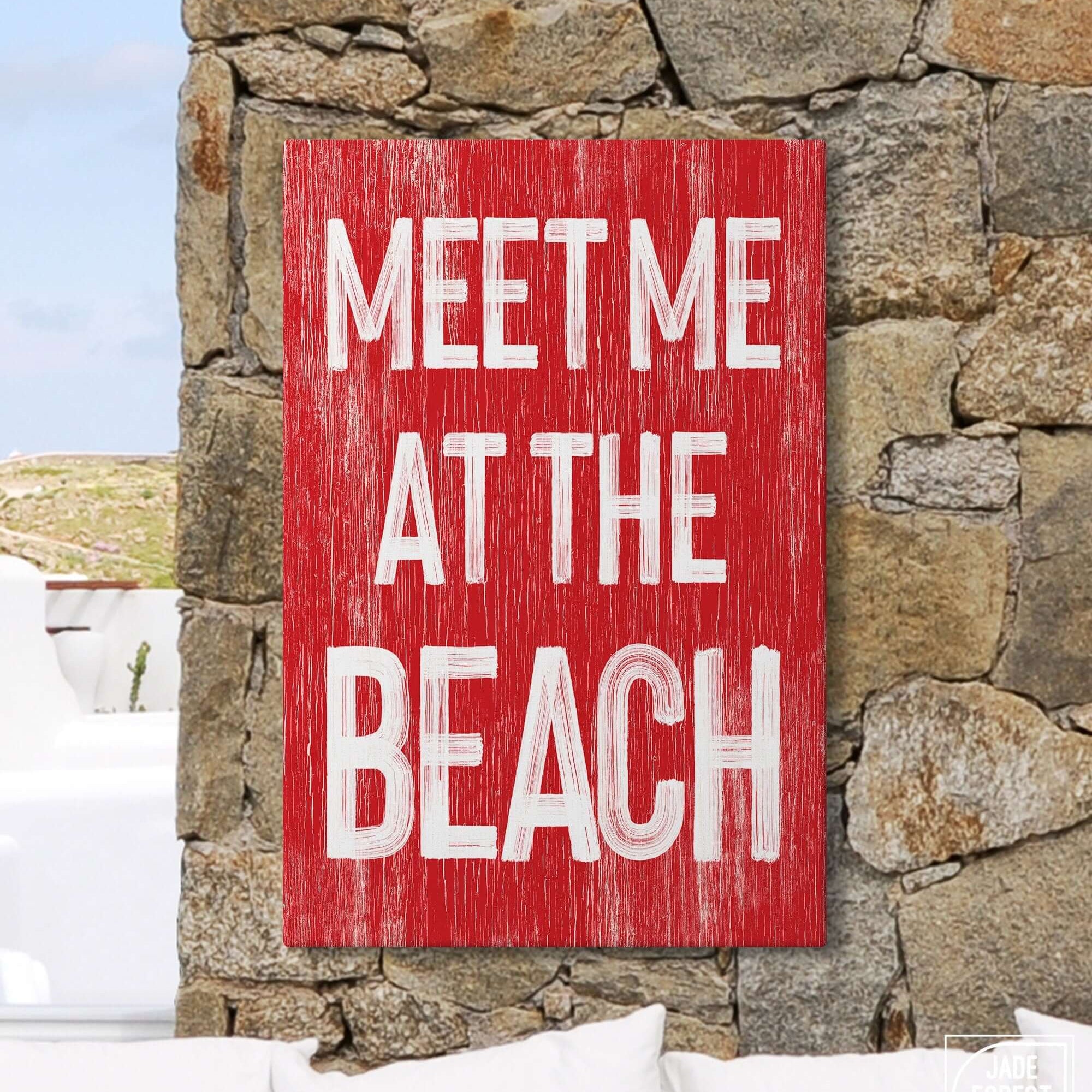 a red sign that says meet me at the beach