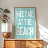 a picture of a sign that says meet me at the beach