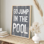 a picture of a sign that says go jump in the pool