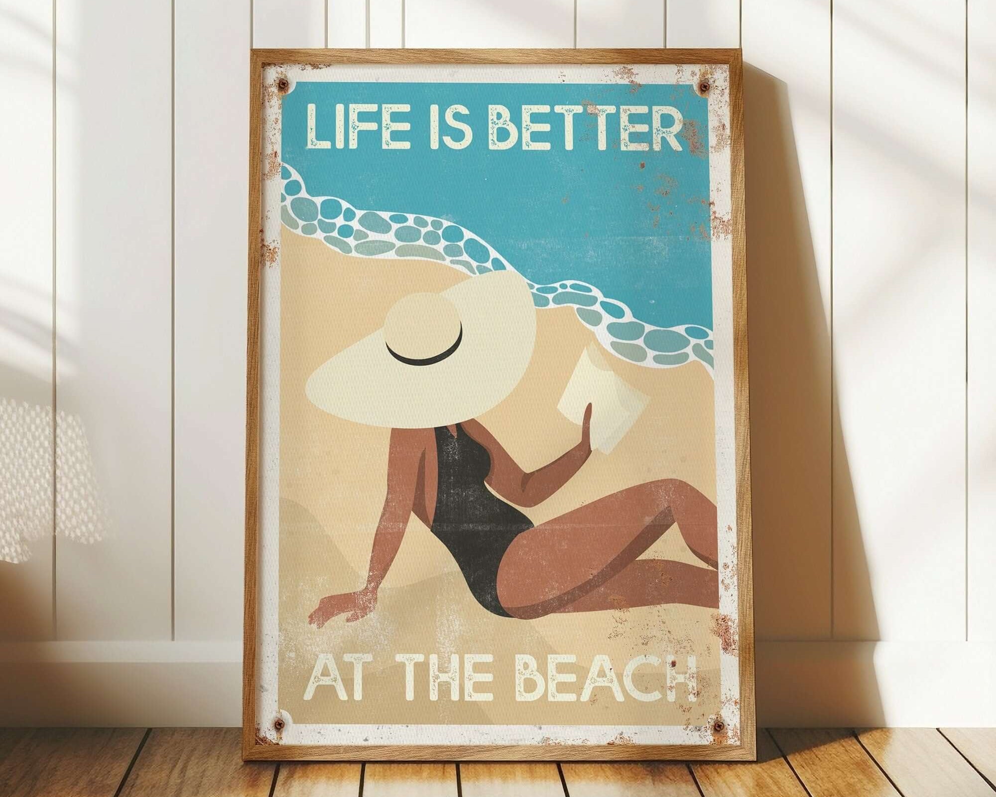 The "Life is Better at the Beach, Retro Beach Poster" features a vintage illustration of a woman relaxing and framed wall decor that adds retro charm to your space.