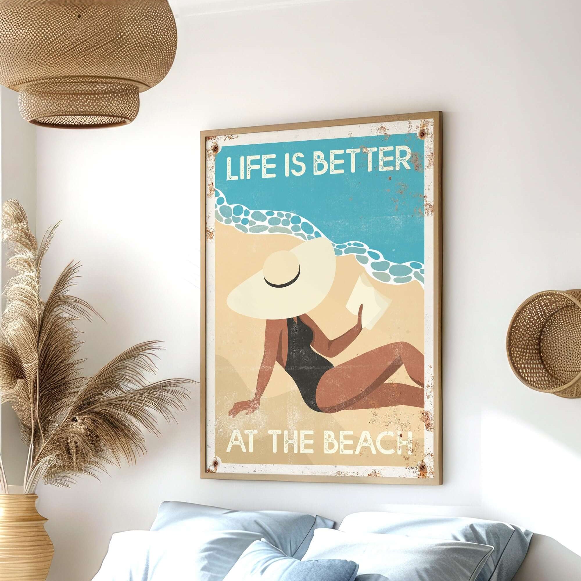 The "Life is Better at the Beach, Retro Beach Poster" features a woman in a sunhat and vintage style, making charming farmhouse wall decor above a bed.
