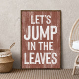 a wooden sign that says let's jump in the leaves