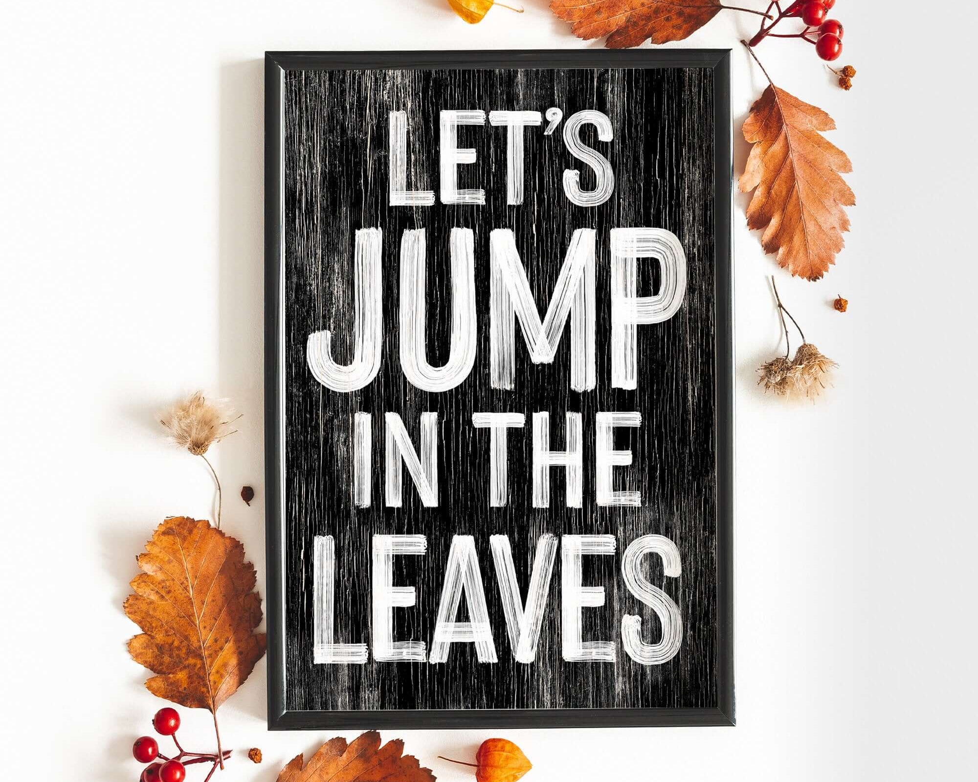 a sign that says let's jump in the leaves