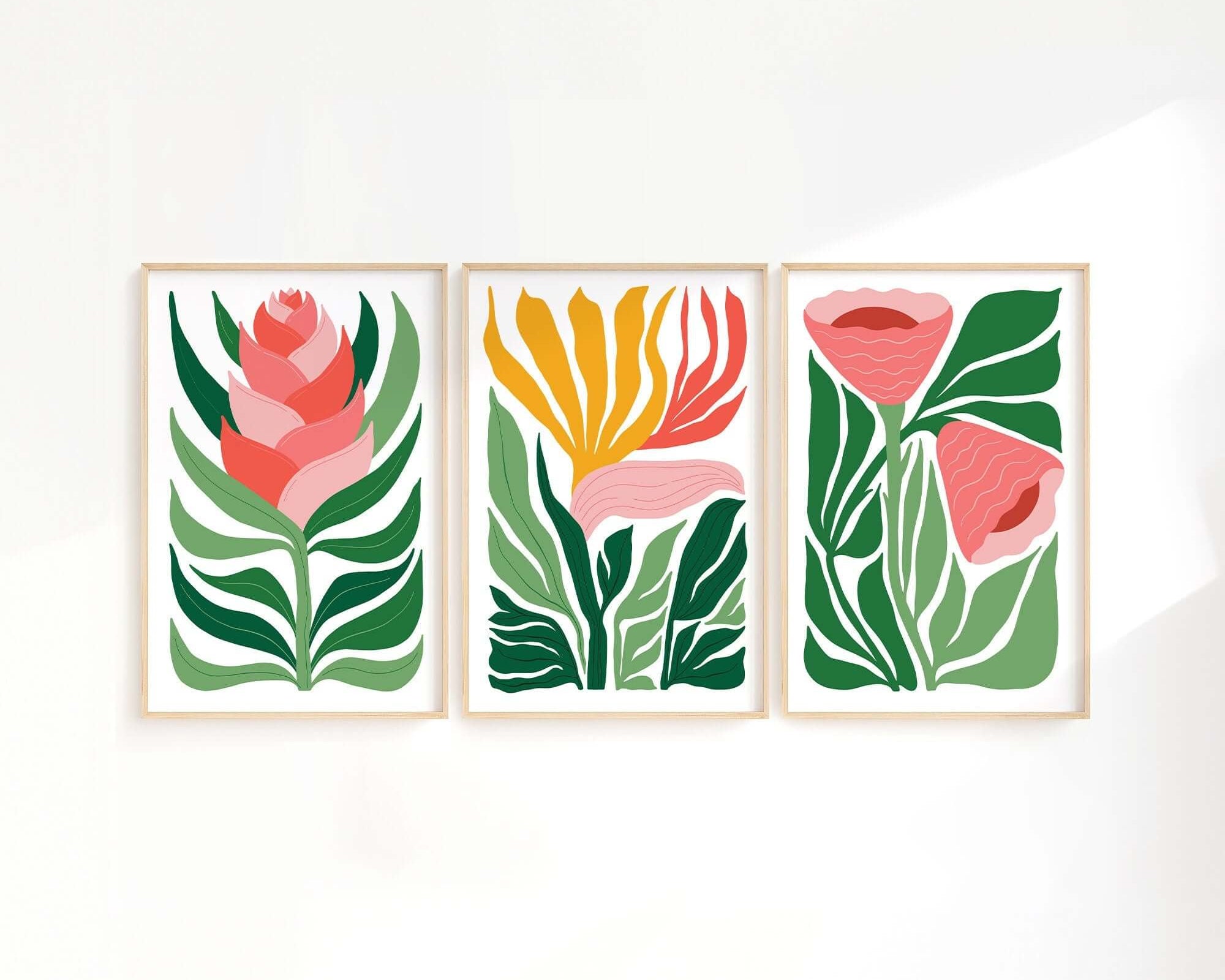 The Tropical Blocks Triptych | Set of Three Prints | 405 features vibrant abstract flowers and green leaves, creating a striking botanical wall art set that’s perfect for enhancing your home decor on a white wall.