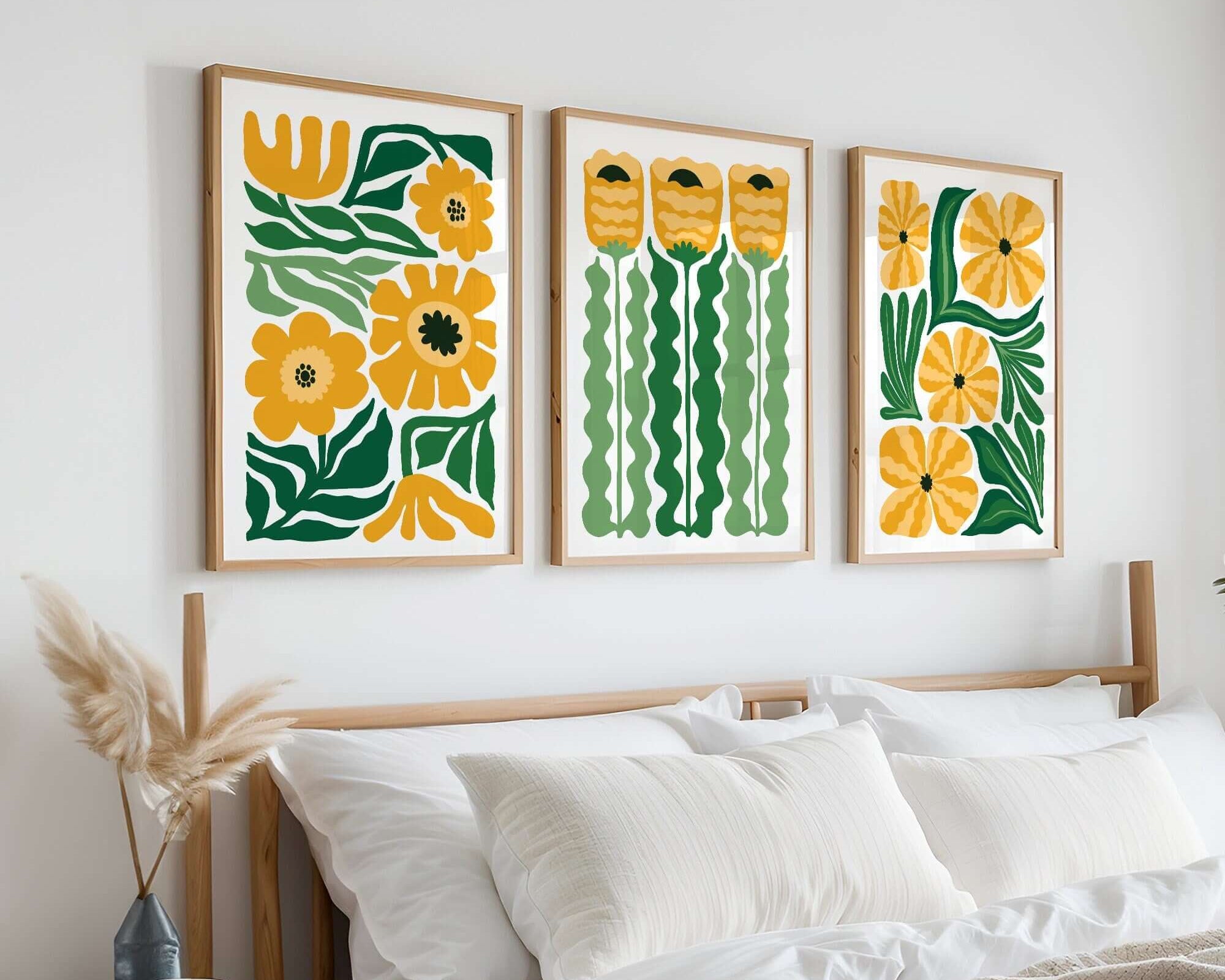 The Tropical Blocks Triptych | Set of Three Prints | 421 features colorful wall art above a neatly made bed with white bedding and a wooden headboard, creating a vibrant and stylish decor centerpiece.