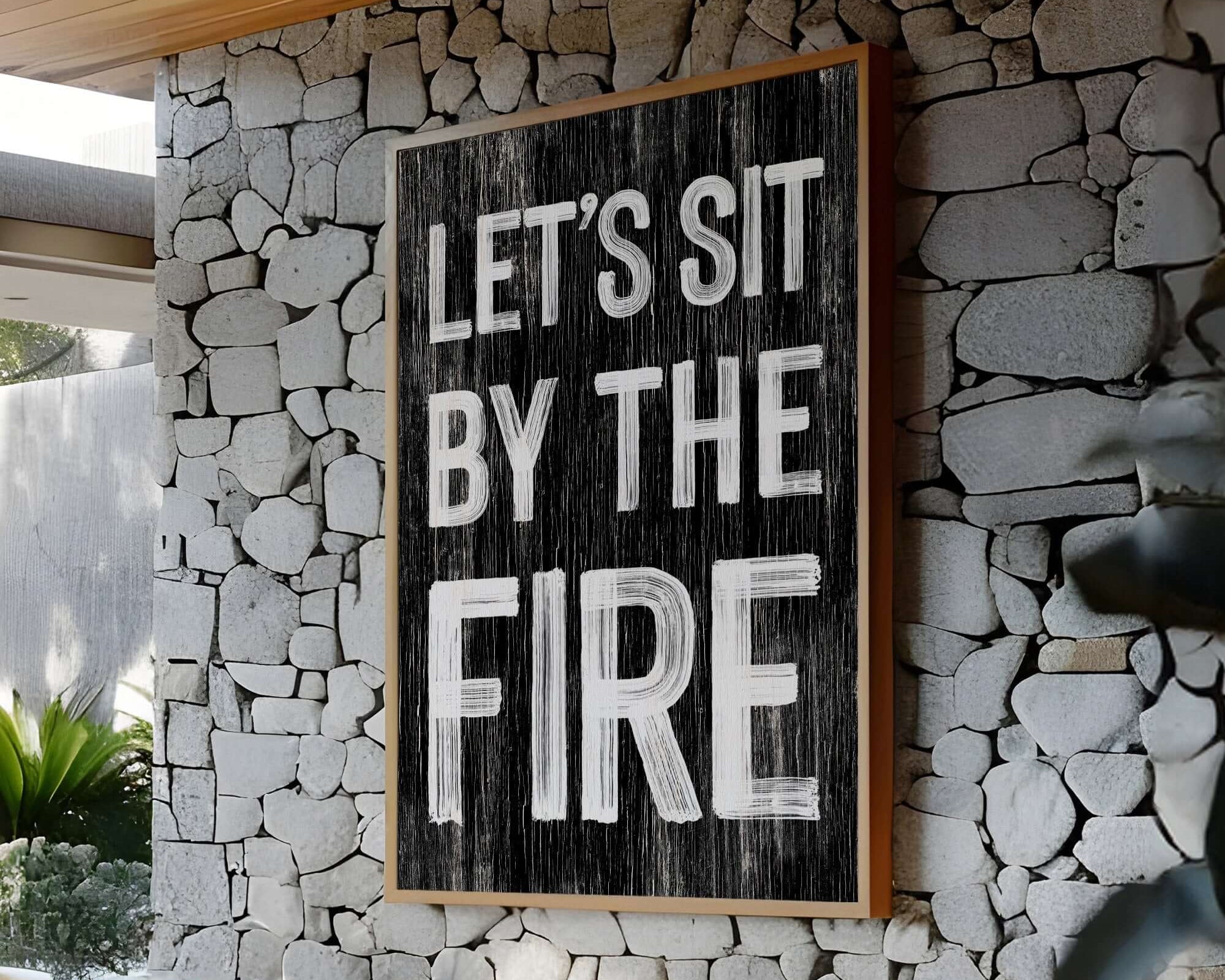 a sign that reads let's sit by the fire