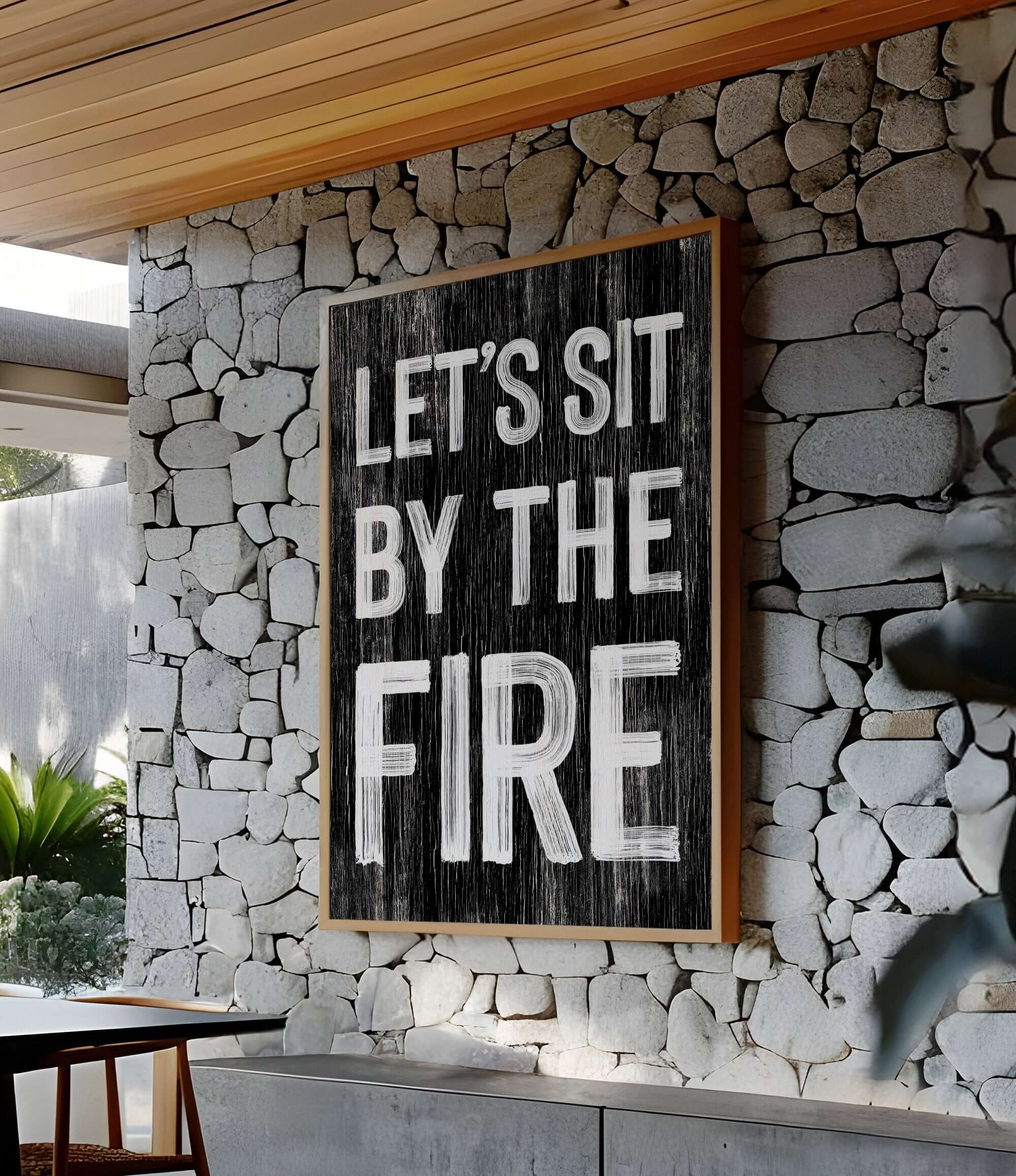 a sign that reads let's sit by the fire