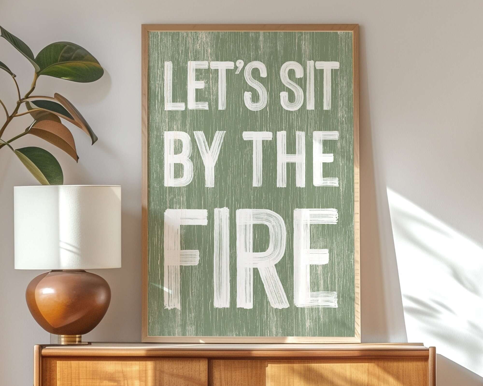 a picture of a sign that says let's sit by the fire