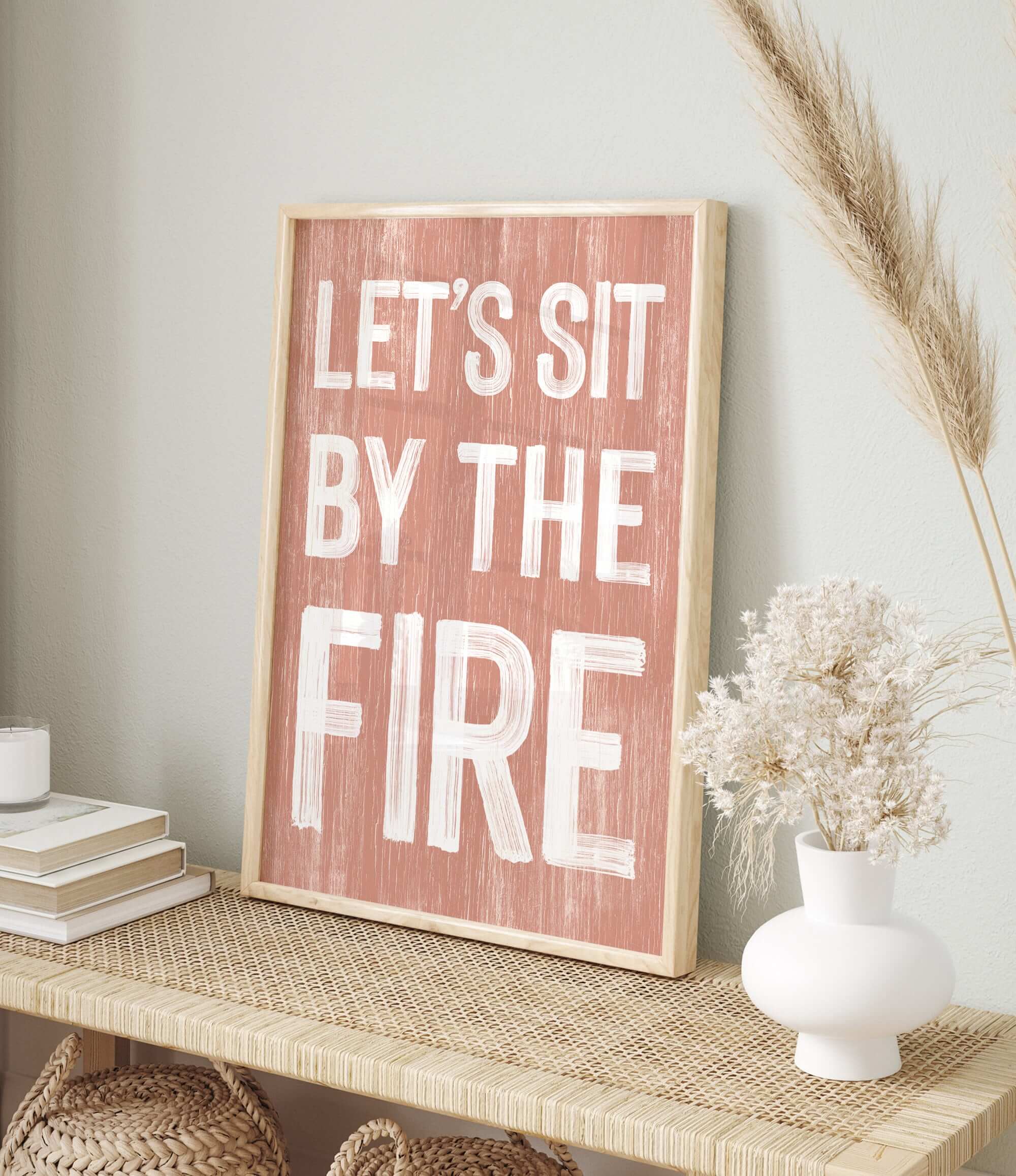 a wooden sign that says let's sit by the fire