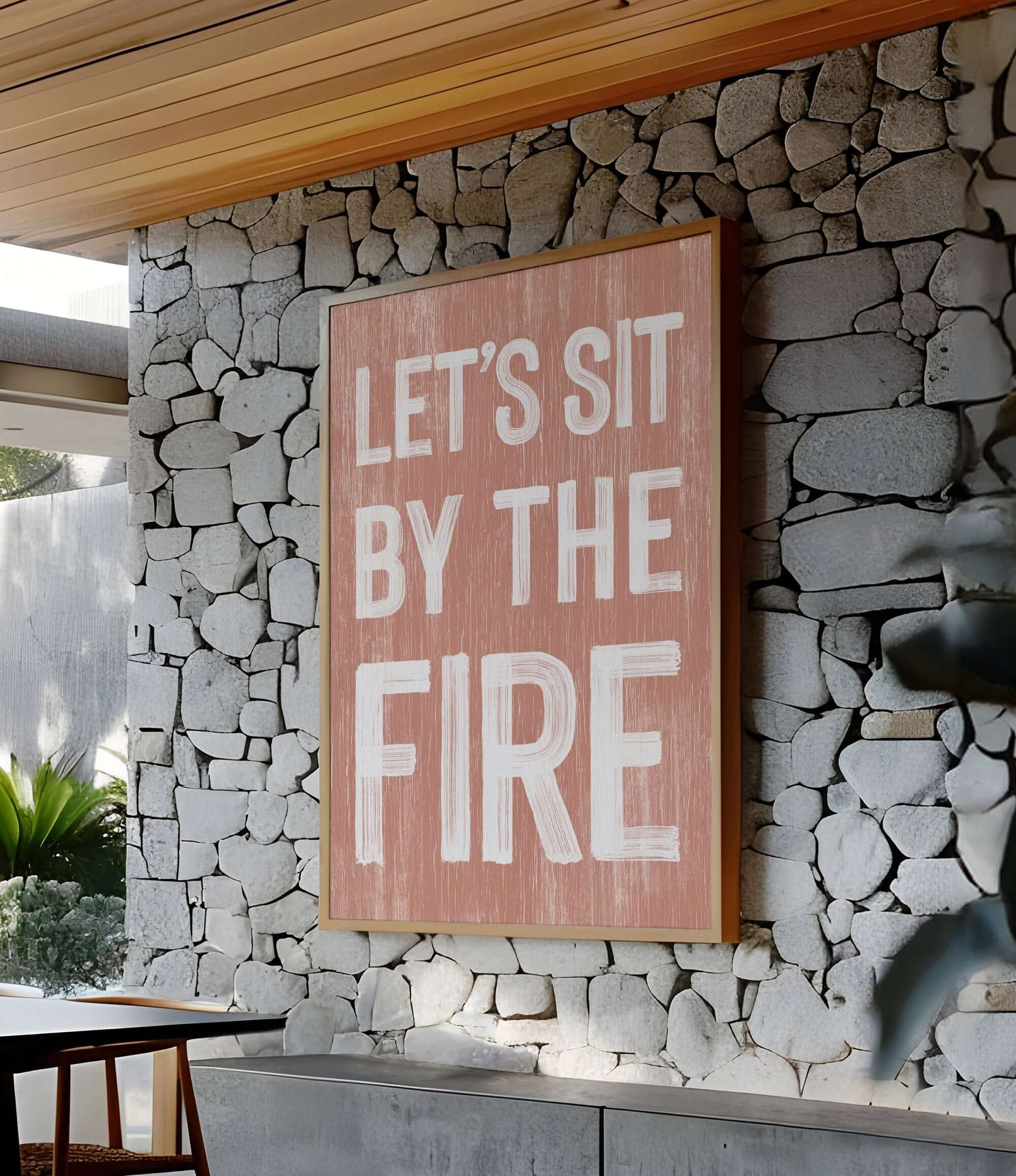 a sign that says let's sit by the fire